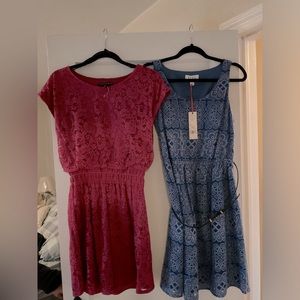 2 cute new dresses -  1 is medium , 1 is small